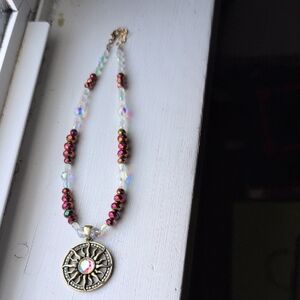 Elegant Beaded Necklace with Sun Pendant